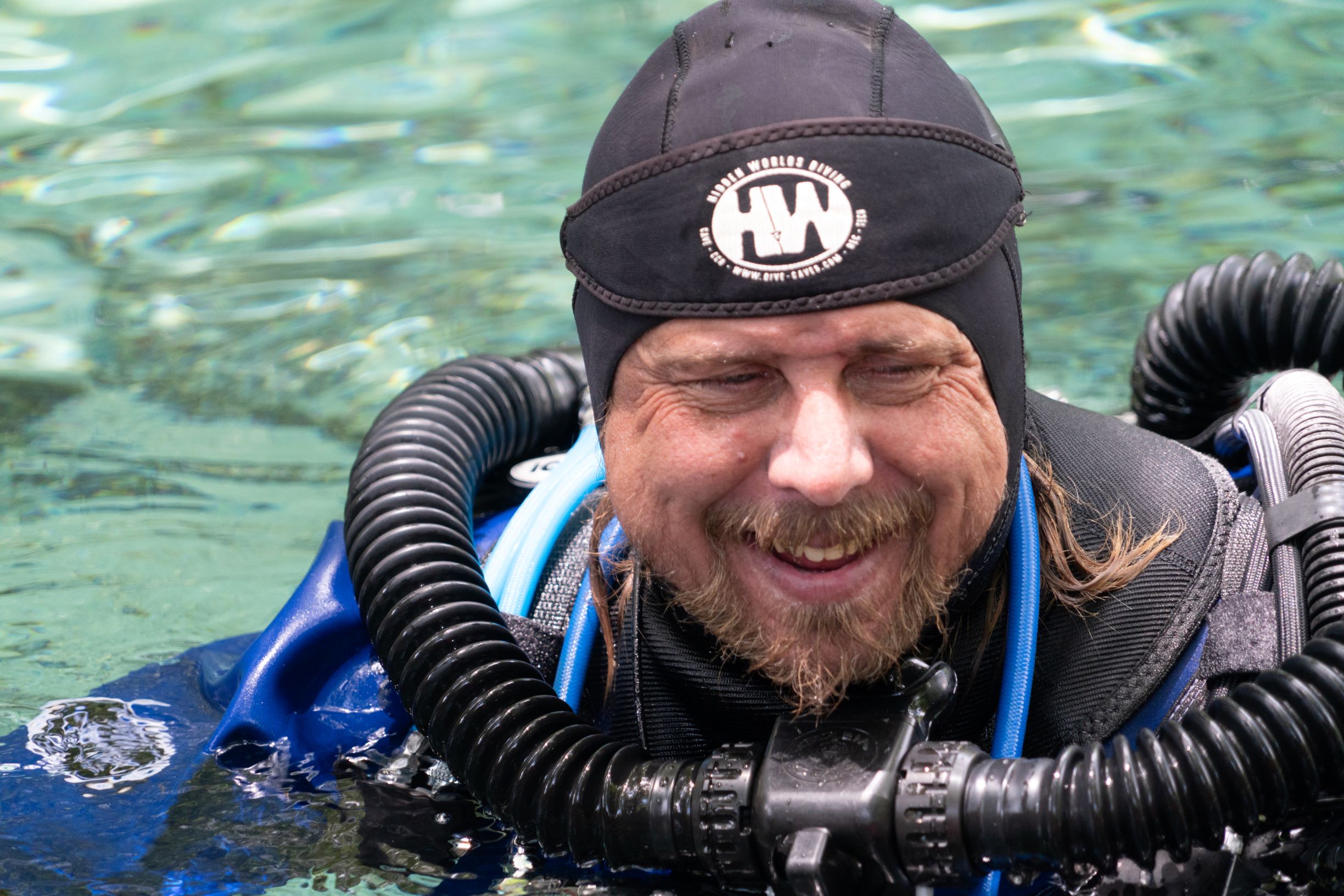 James Drake floating on the surface wearing a Prism 2 rebreather