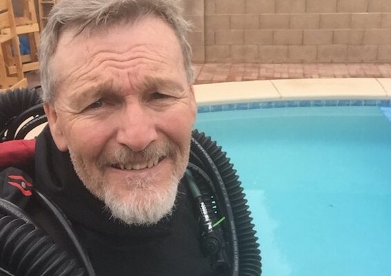 Eric Brooks wearing a Prism 2 Rebreather next to a pool